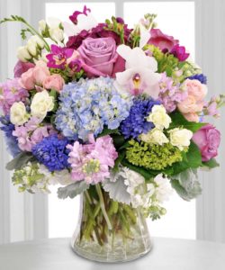 blue and green flowers with pastel pink flowers