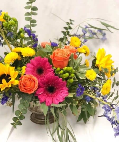 Take a break, unplug and re-energize with the bold, bright and beautiful colors of summertime. These Sunflowers, Gerbera Daisies and Roses are surrounded by types and textures proven to enhance mental health and happiness.